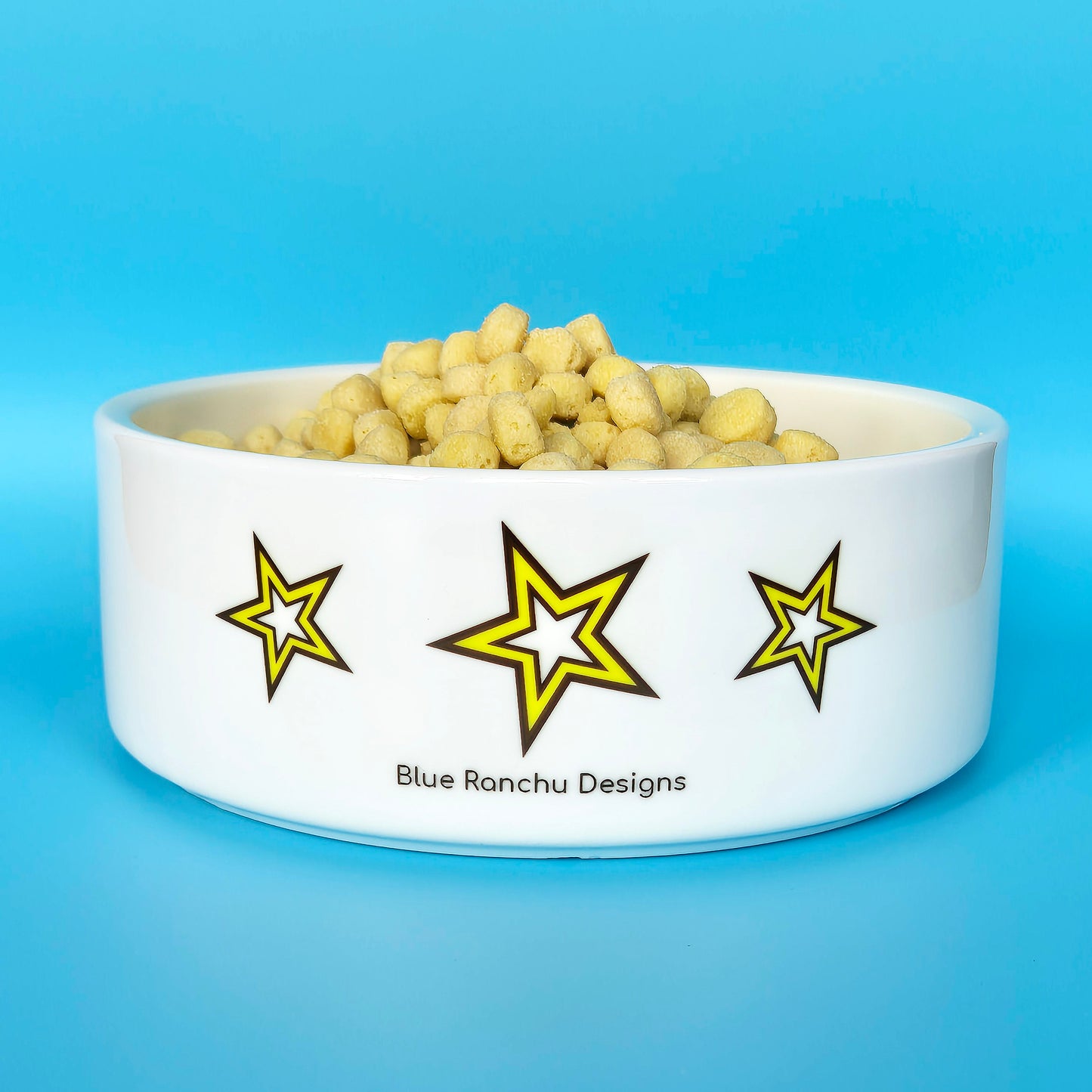 Back of ceramic pet bowl with three stars and logo