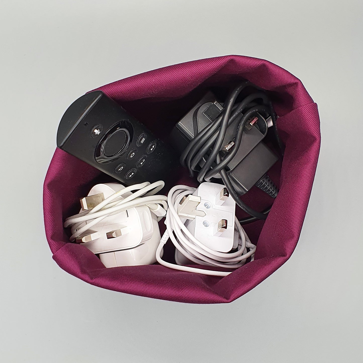 Dahlia fabric basket shown storing chargers