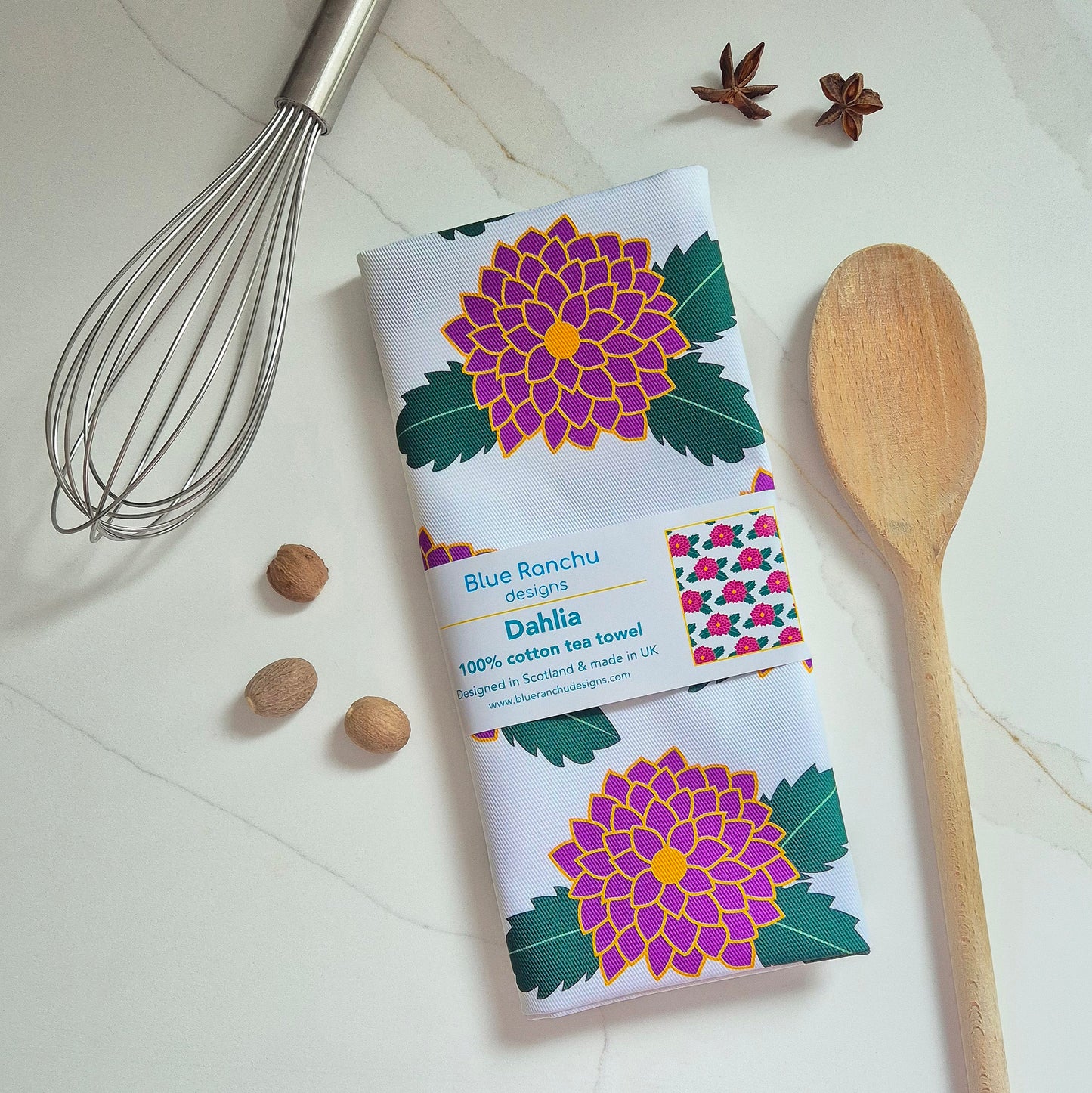 Dahlia cotton tea towel folded on kitchen worktop