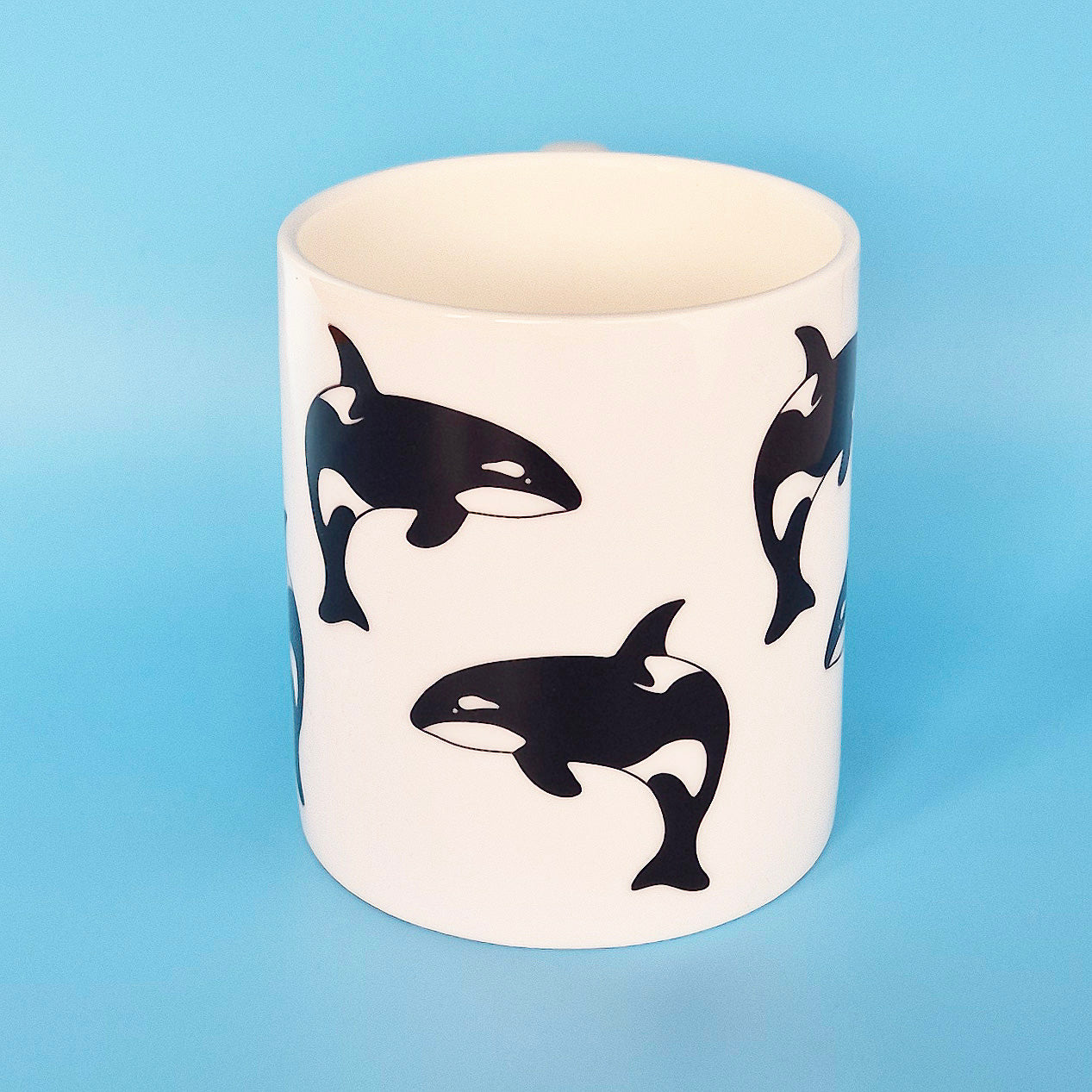 White bone china mug with leaping Orca design