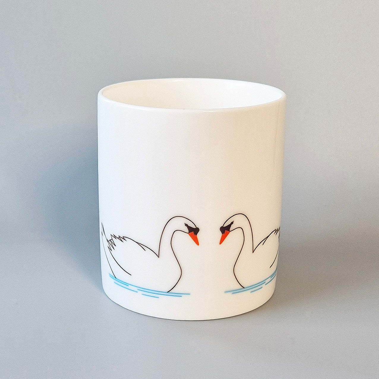 Three swans on a bone china mug