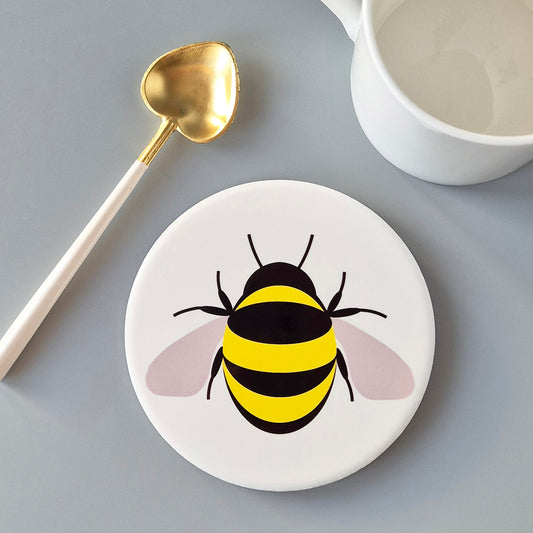 Round white ceramic coaster with alarge single Bee design
