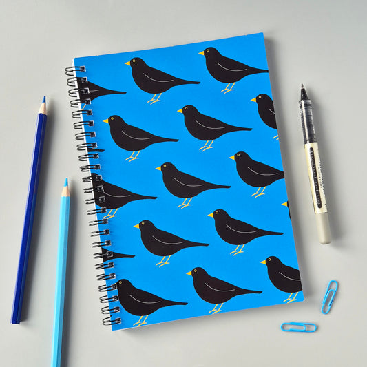 Blue A5 wirebound notebook with a blackbird pattern