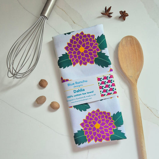 Dahlia cotton tea towel folded on kitchen worktop