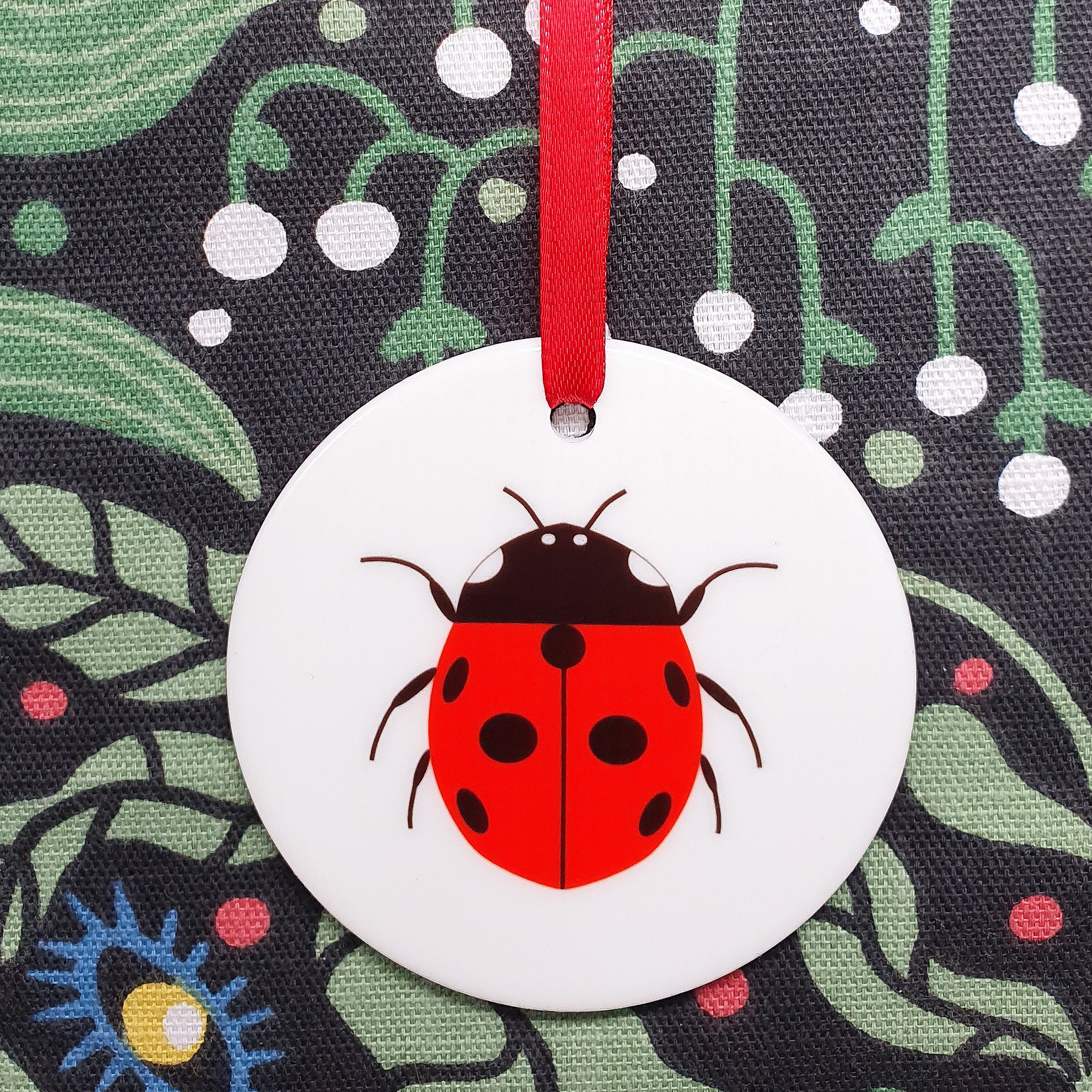 Ladybird ceramic hanging decoration with red ribbon