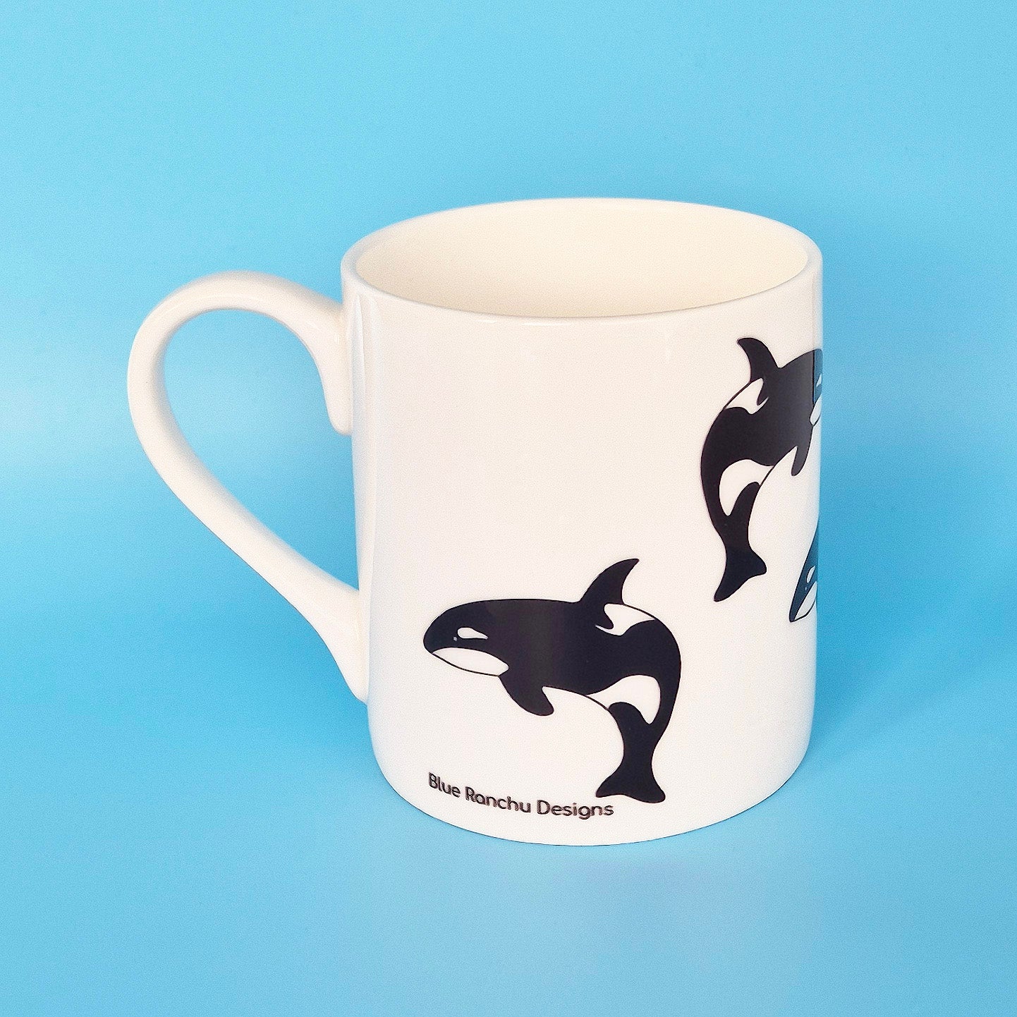 White bone china mug with leaping Orca design