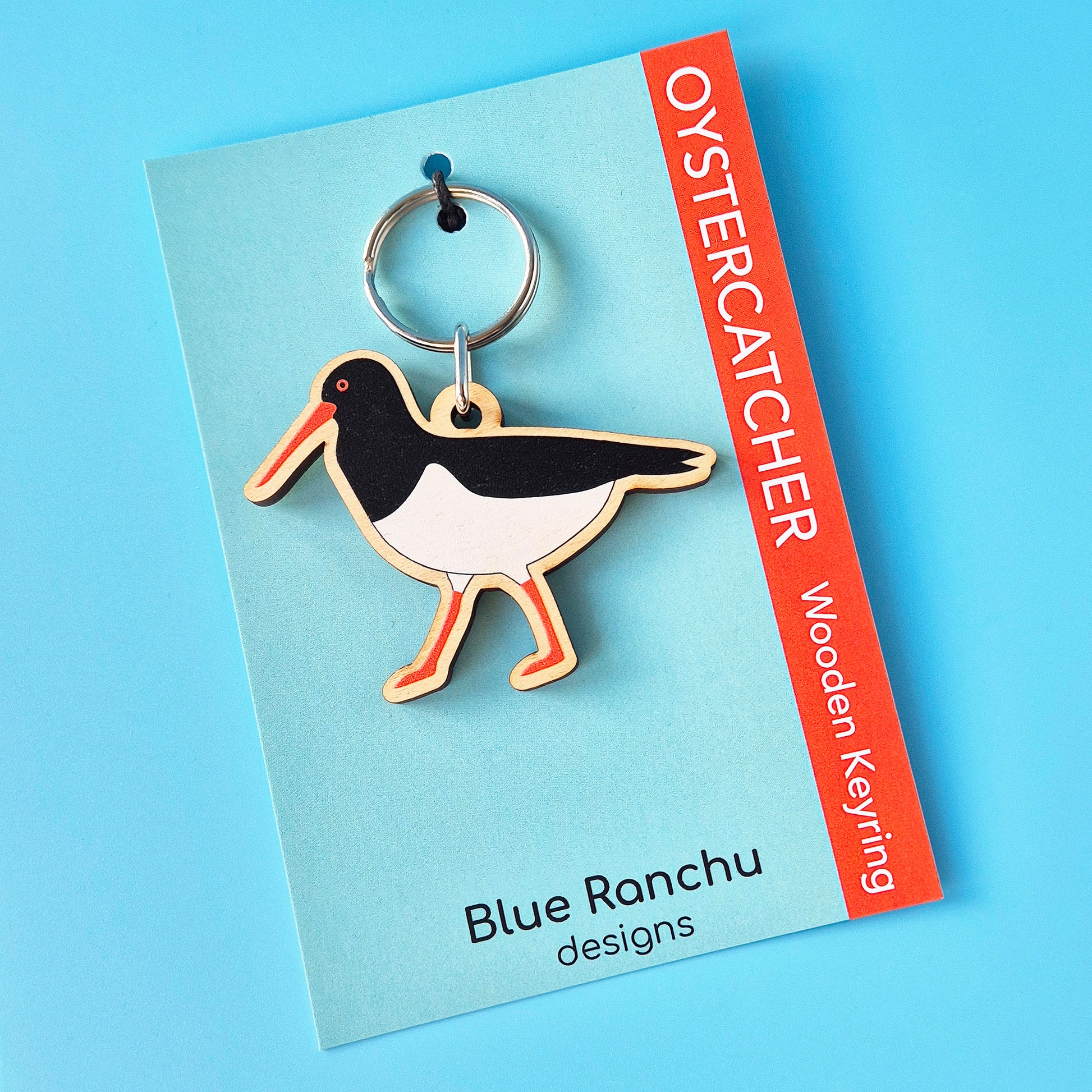 Oystercatcher wooden keyring on a Blue Ranchu designs card with a blue background