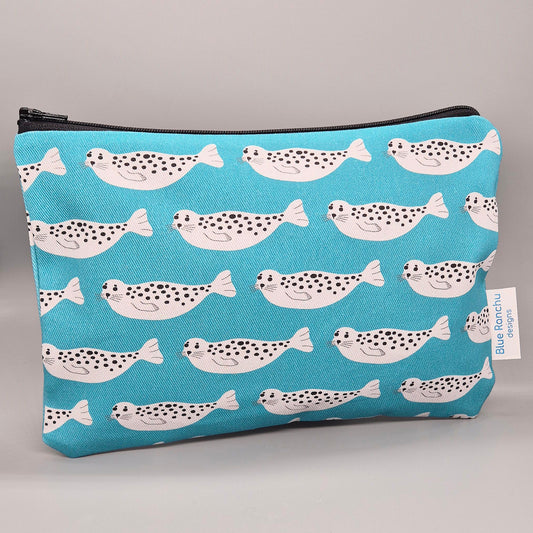 Grey Harbour Seal repeat pattern on a turquoise background handmade accessories bag