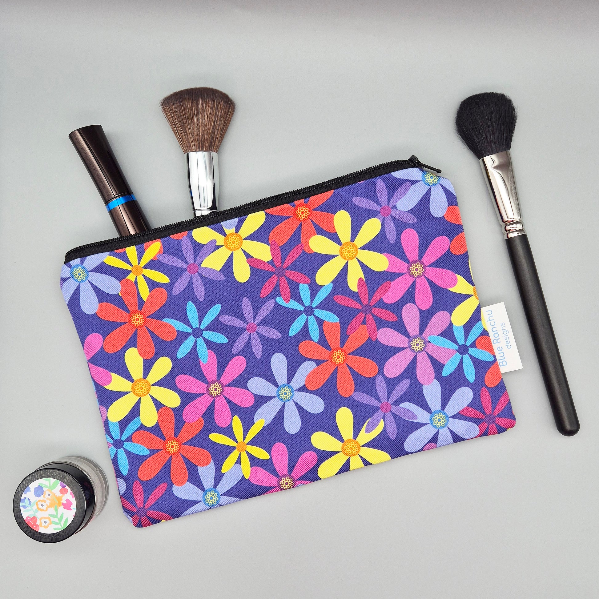Multicoloured summer flowers make up bag