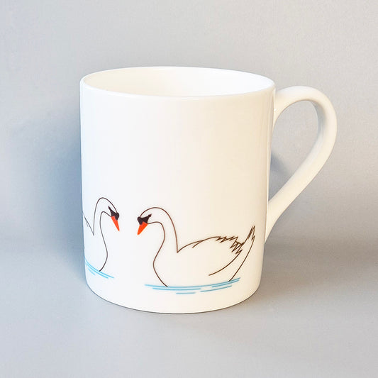 Three swans on a bone china mug