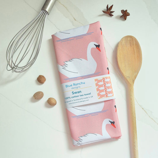 Swan tea towel folded on kitchen worktop