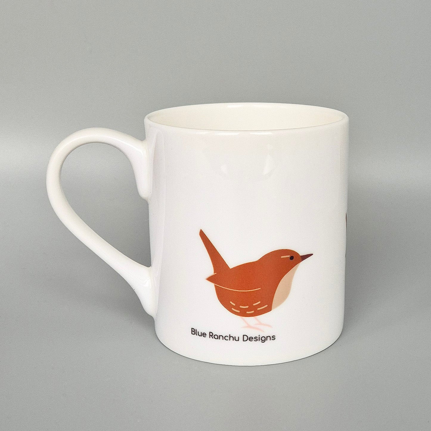White bone china mug with Wren illustration