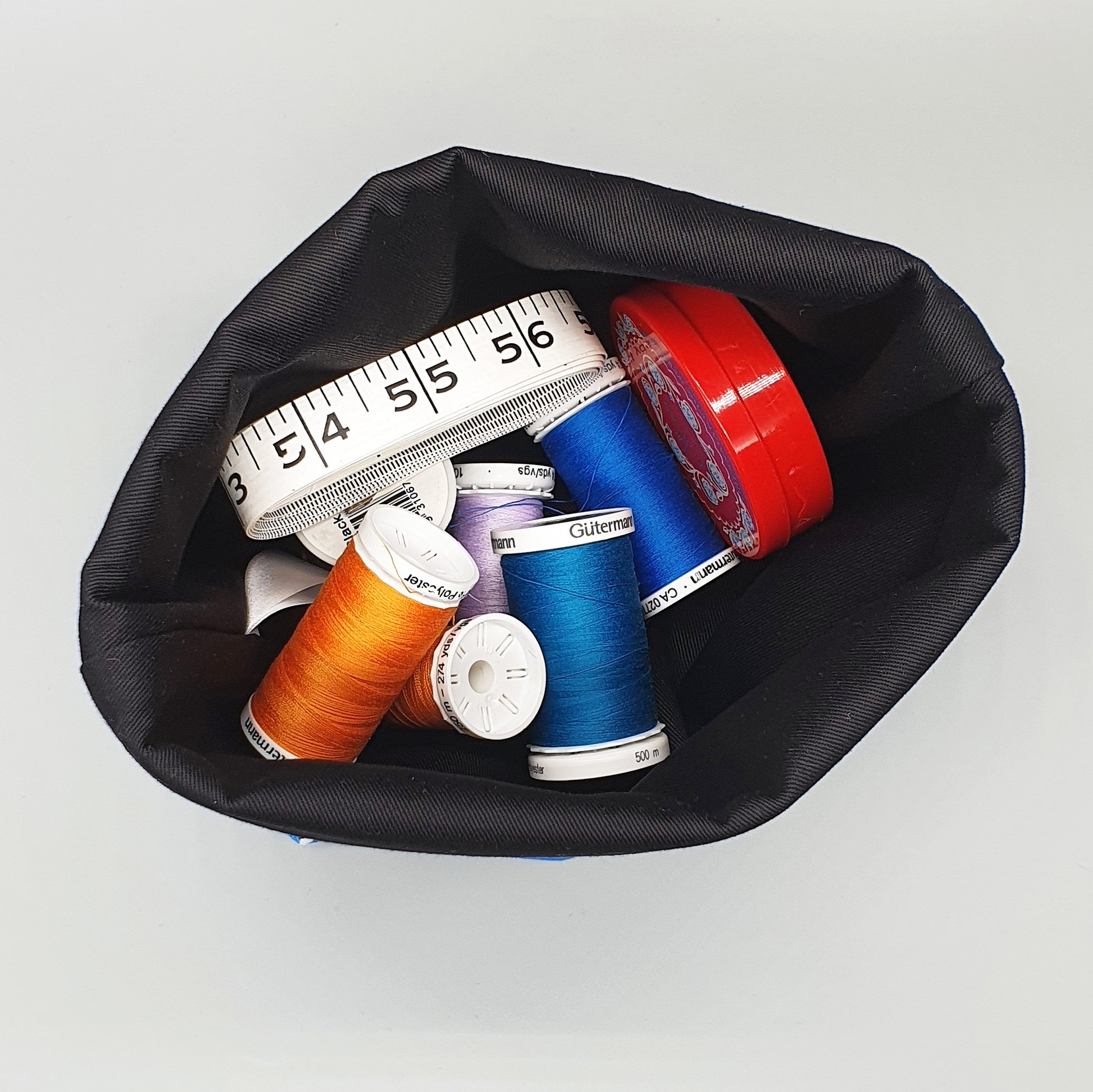 Interior of Border Collie Fabric Storage Basket showing sewing supplies being stored