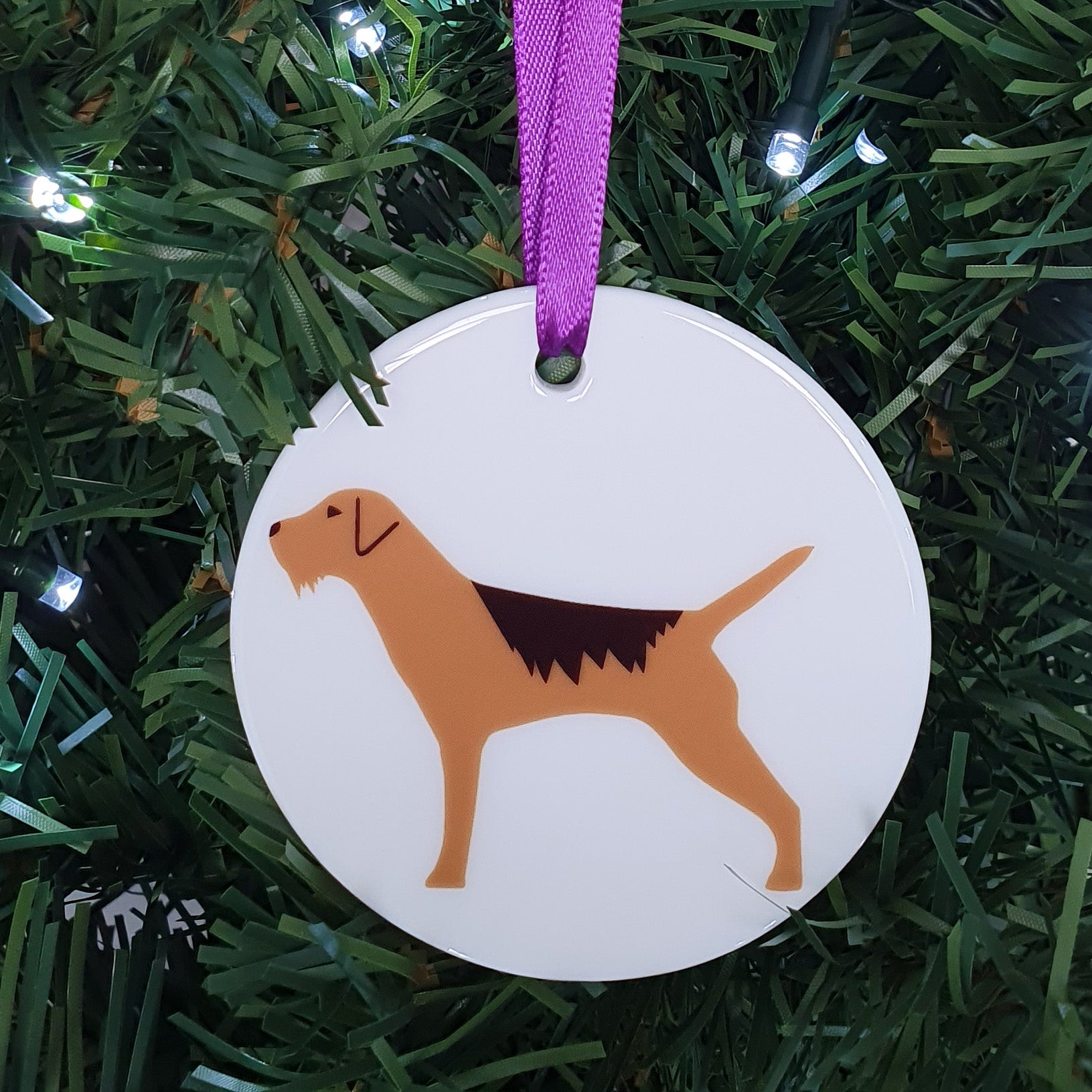 Border Terrier ceramic hanging decoration in Christmas tree
