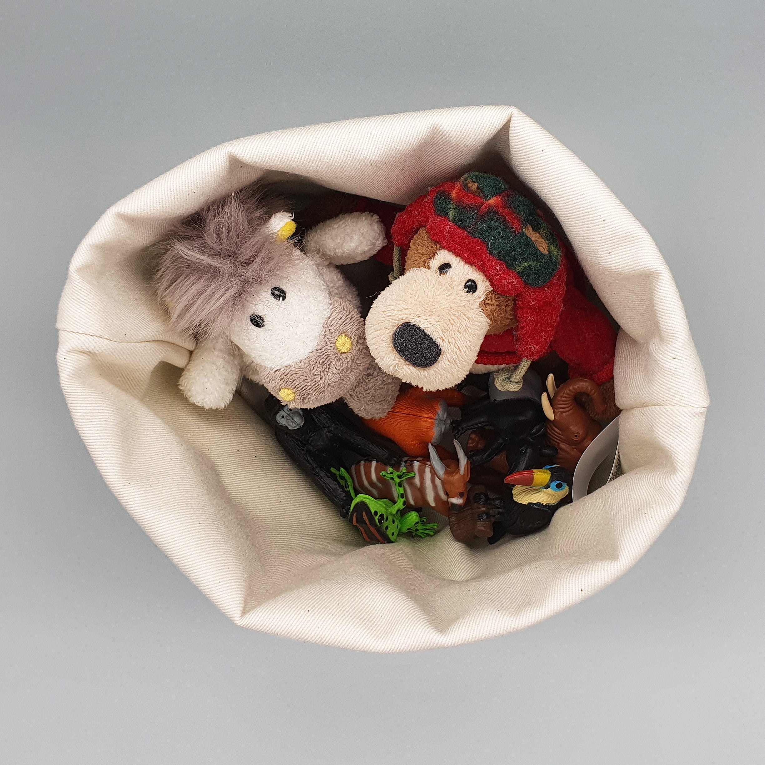 Cats fabric storage basket shown storing toys