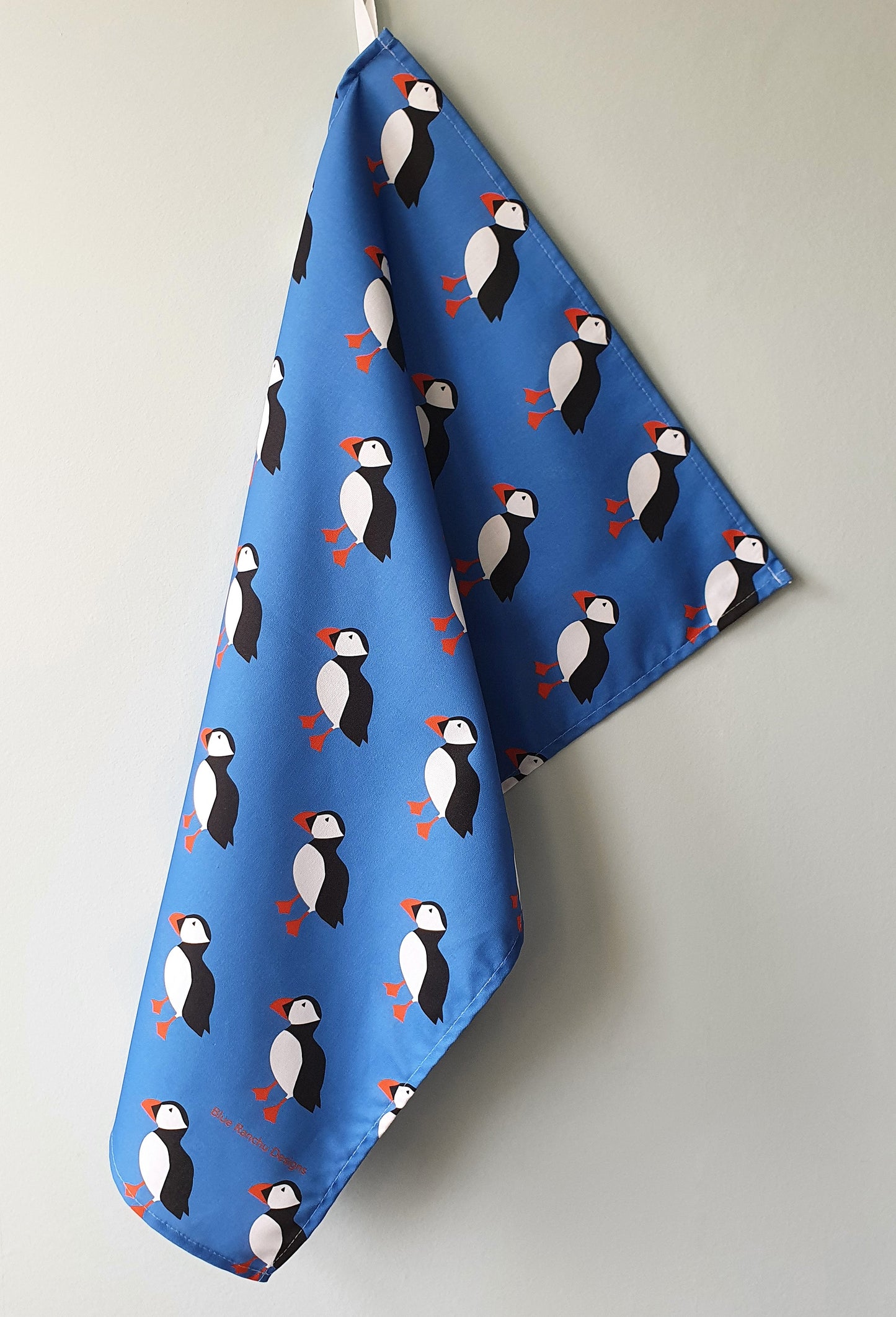 Puffin tea towel hanging up