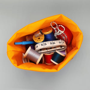 Puffin storage basket with sewing equipment