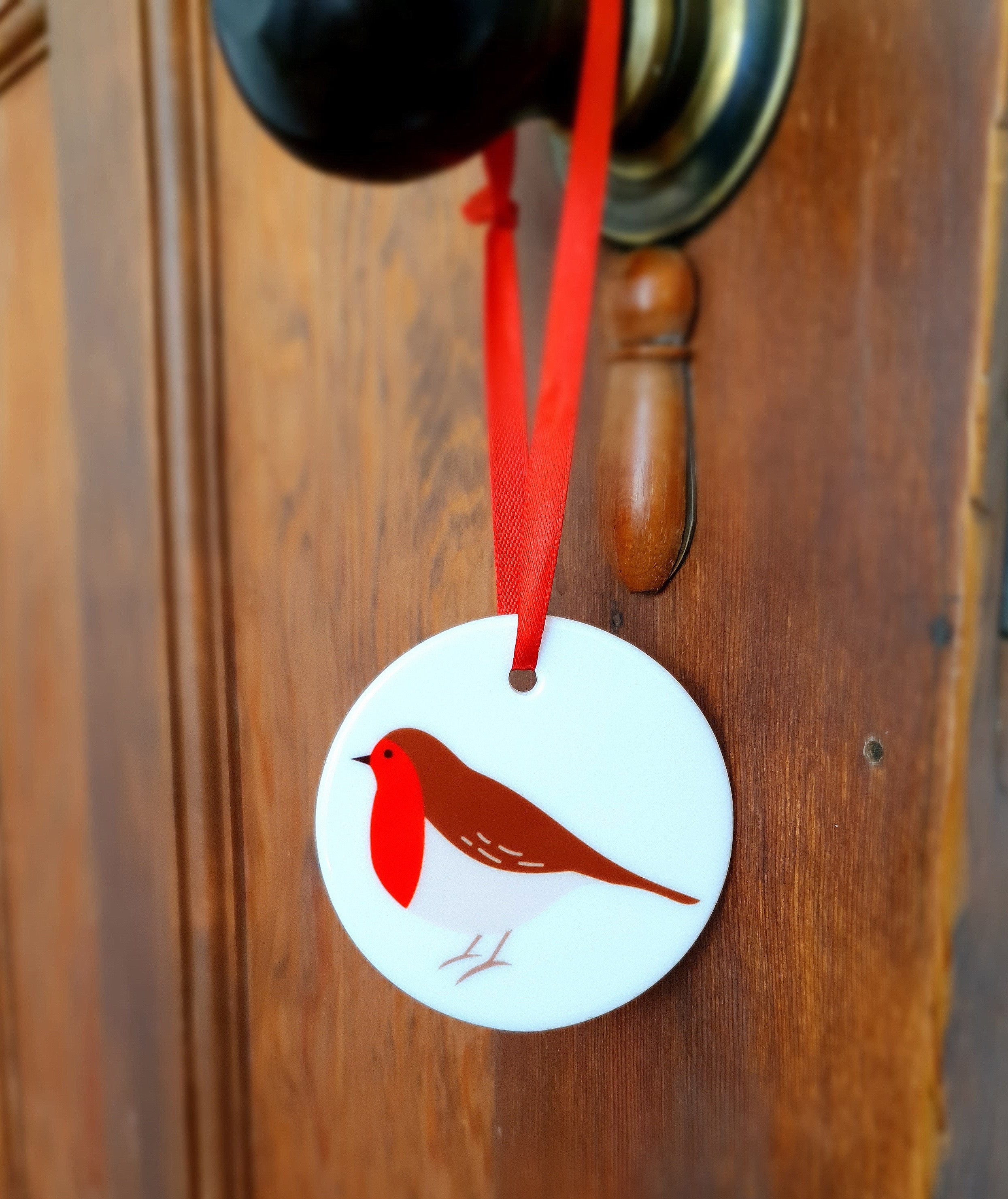 Robin ceramic hanging decoration on door handle